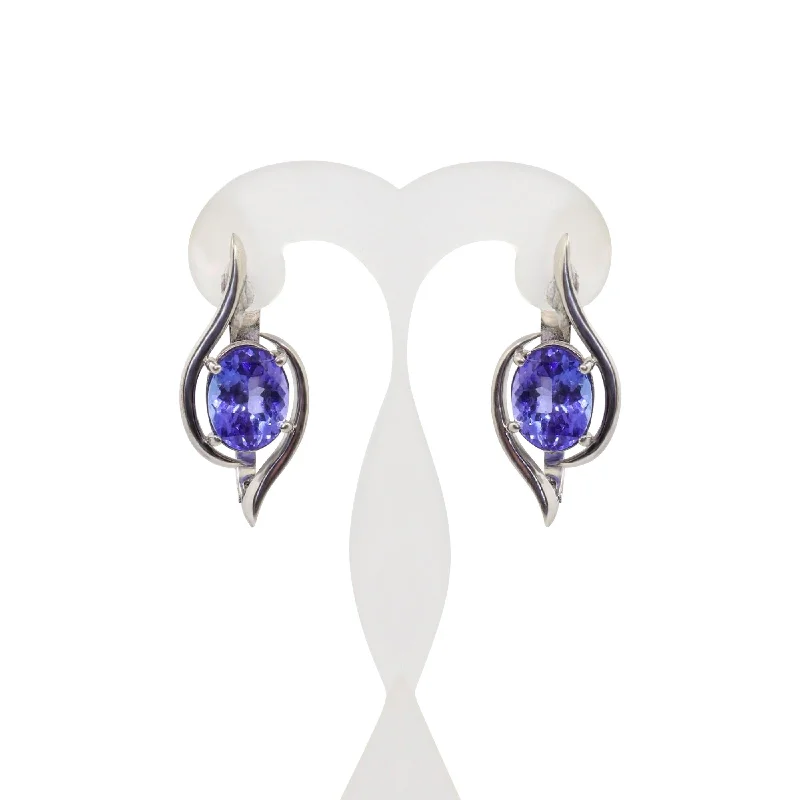 Dazzling Drop Earrings For Special Occasions-18 kt White Gold Four Claw Oval Tanzanite Swirl Earrings